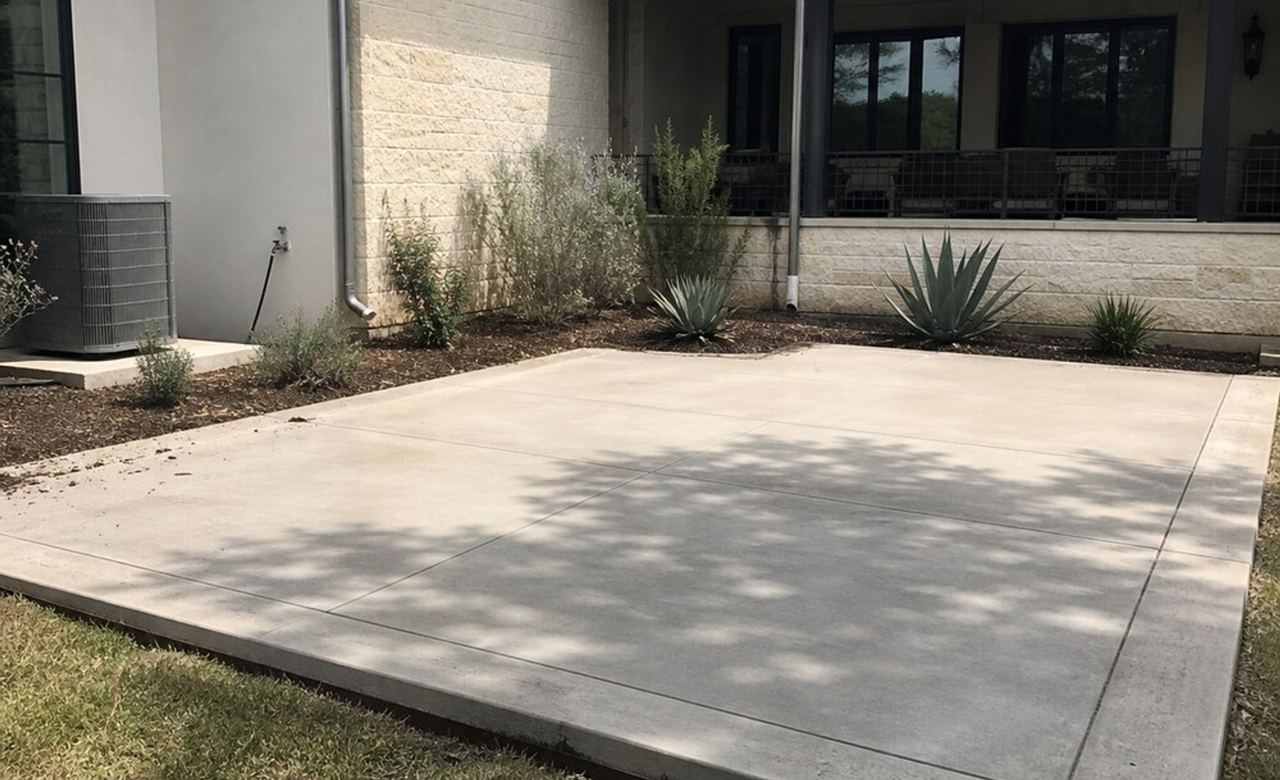 Concrete walkway leading through an Austin yard