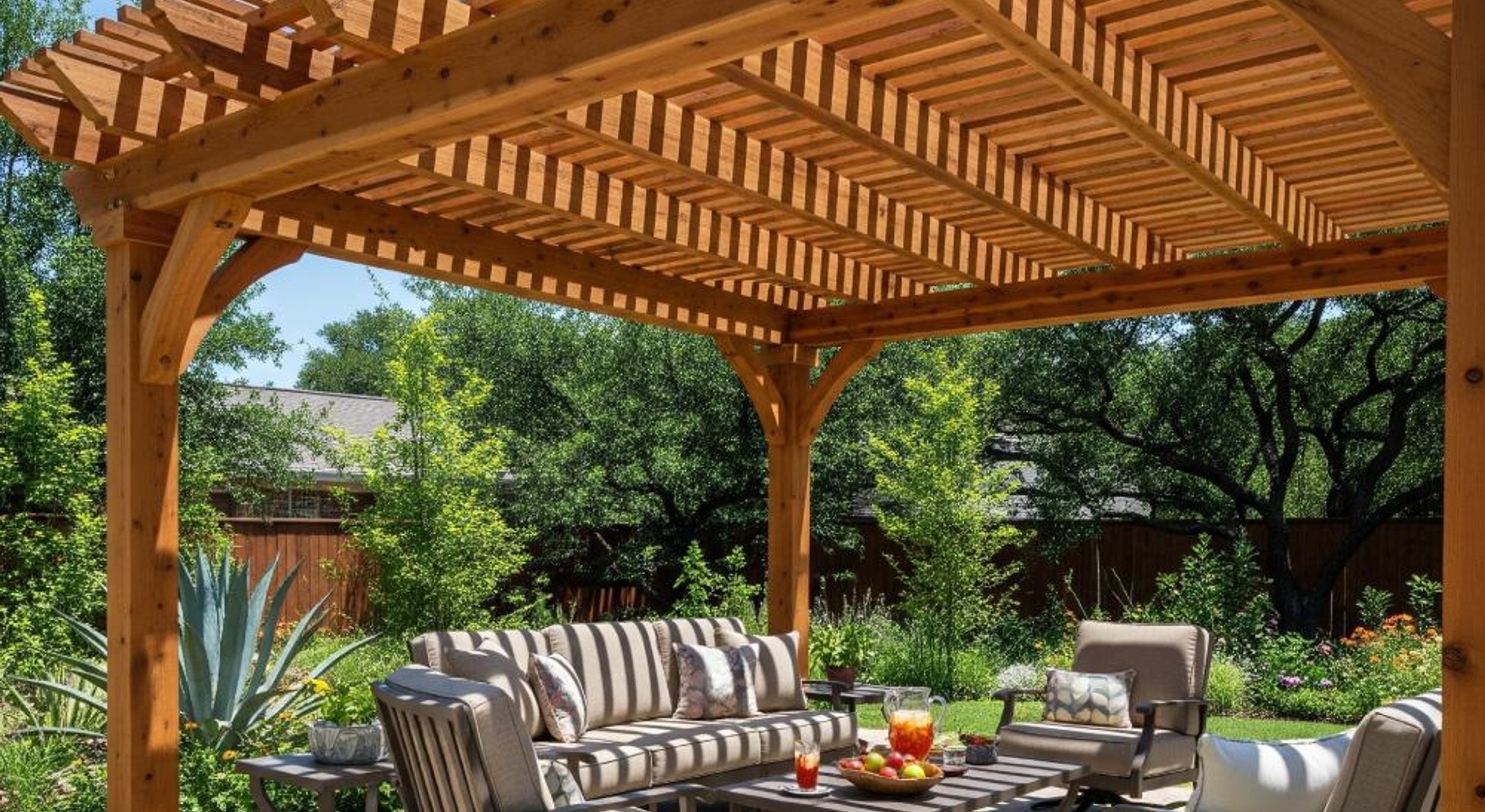 Custom cedar wood pergola over an Austin backyard patio