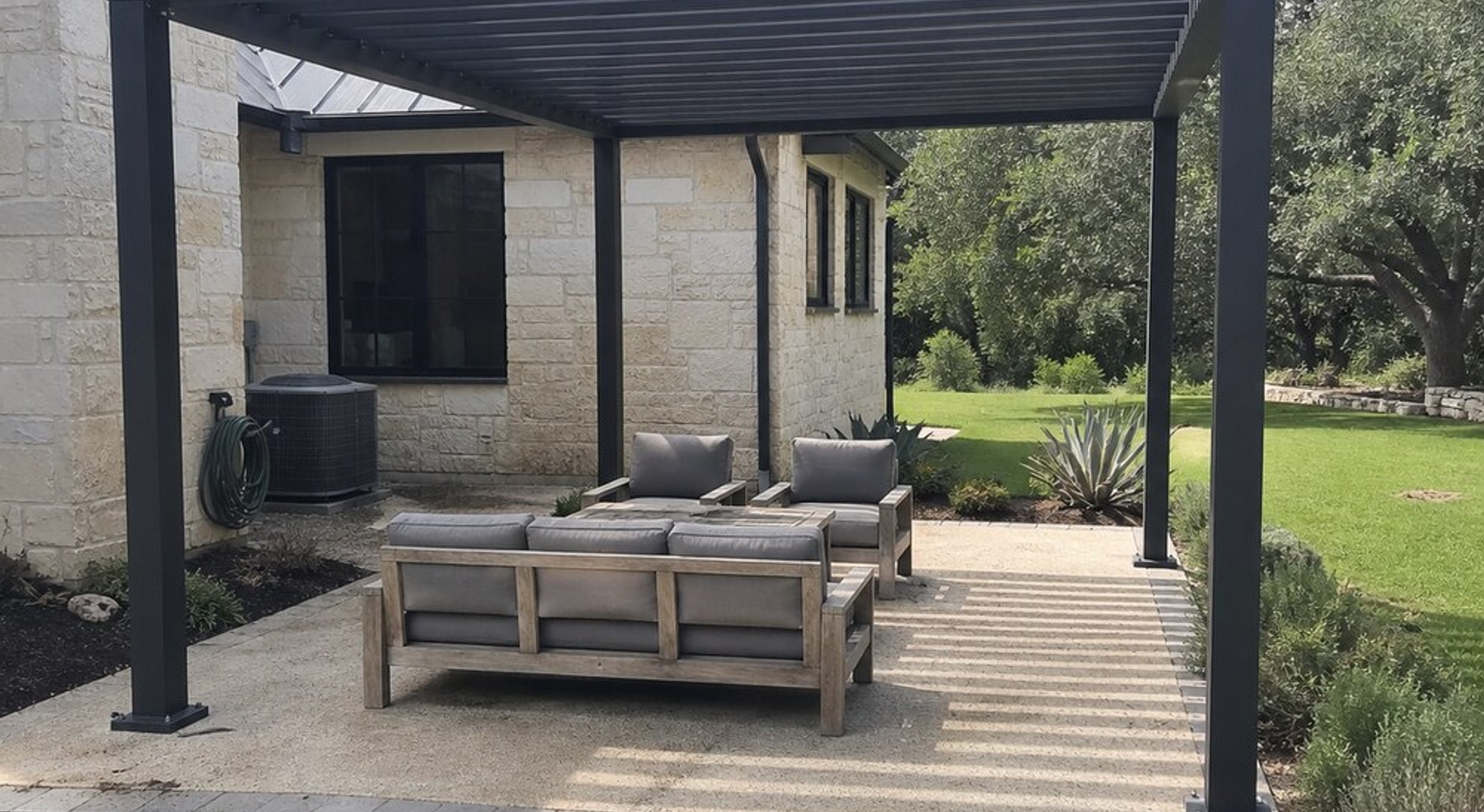 Modern aluminum metal pergola over an Austin patio