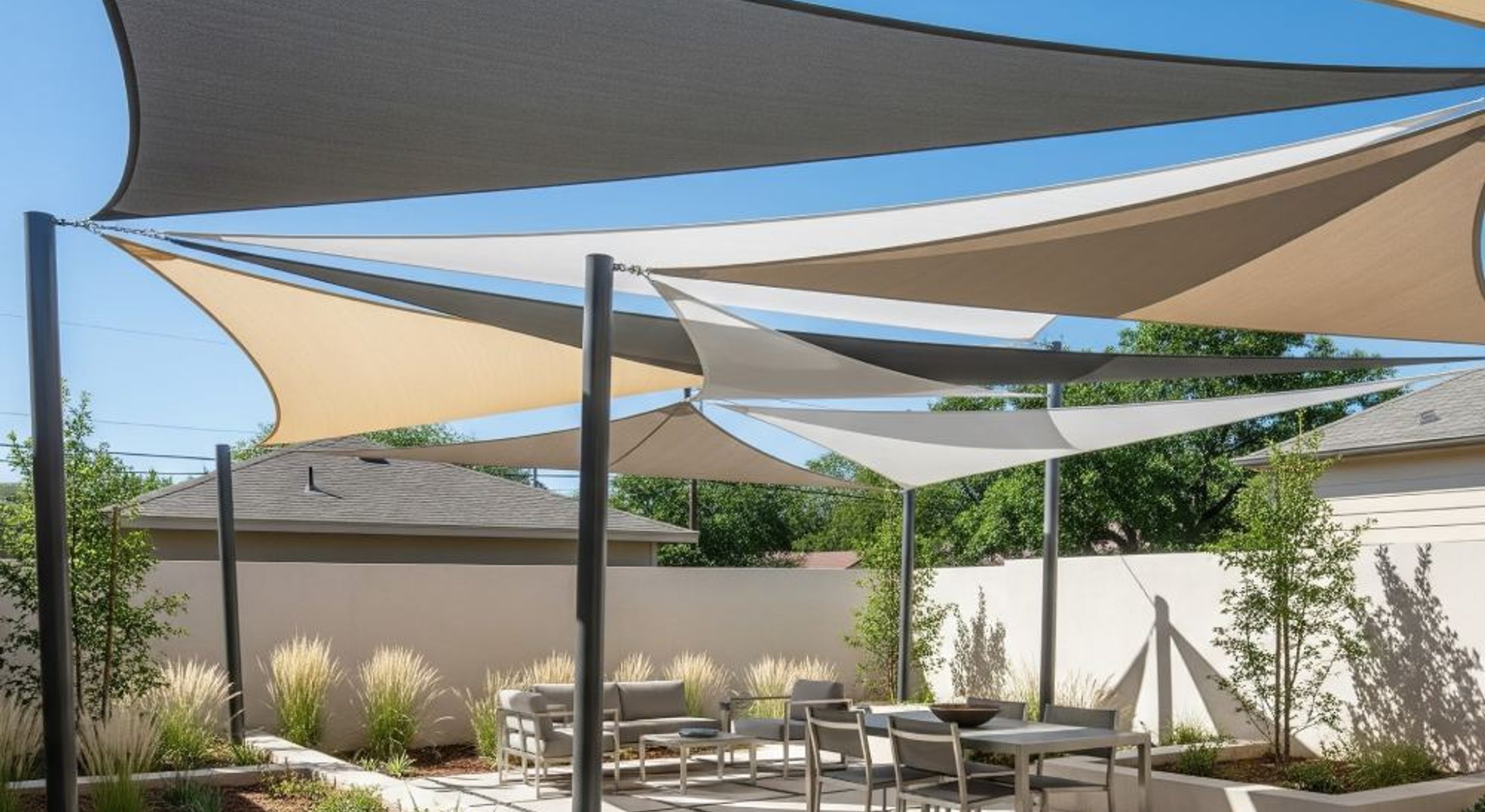 Patio awning and shade sail over an Austin outdoor space