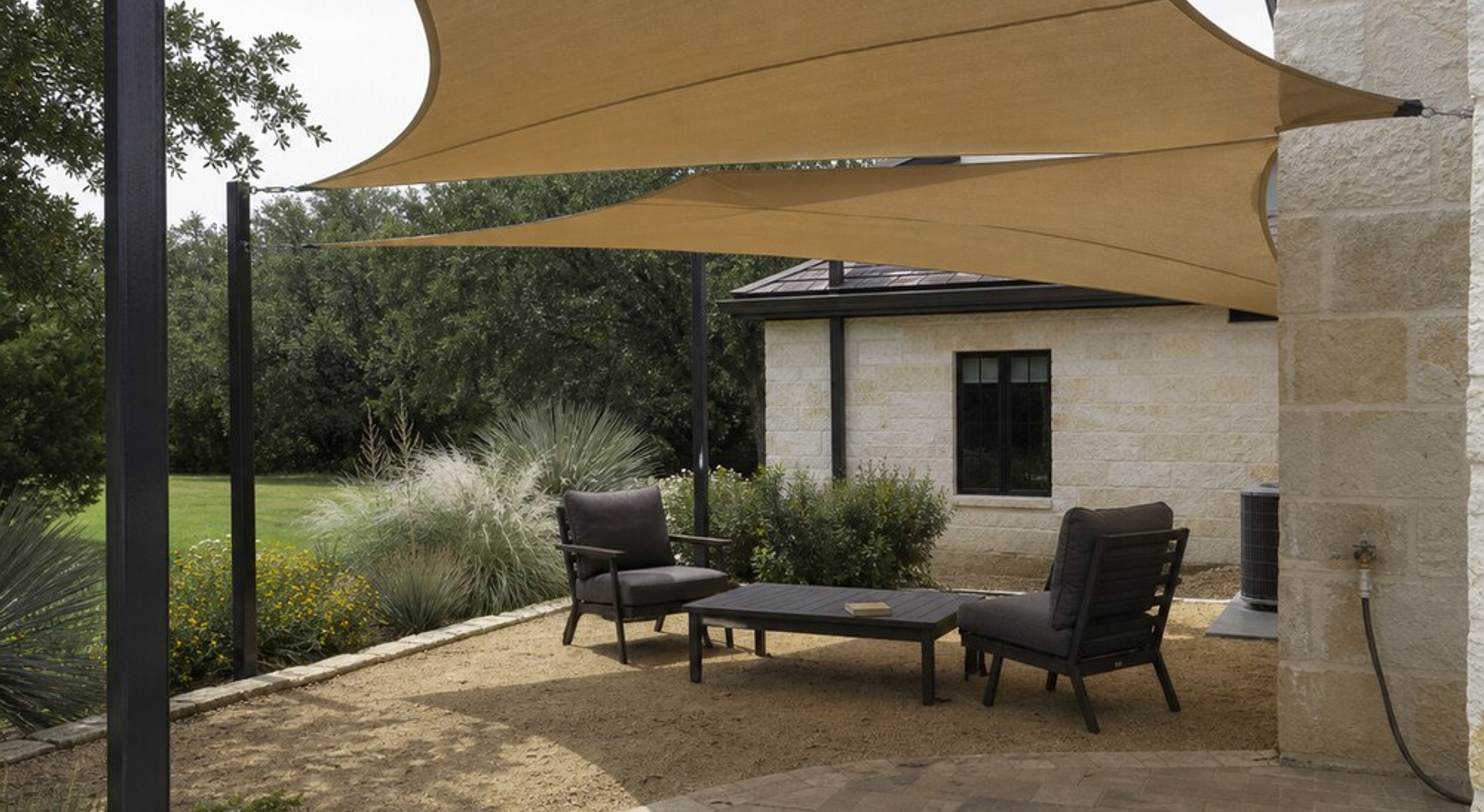 Patio awning and shade sail over an Austin outdoor space