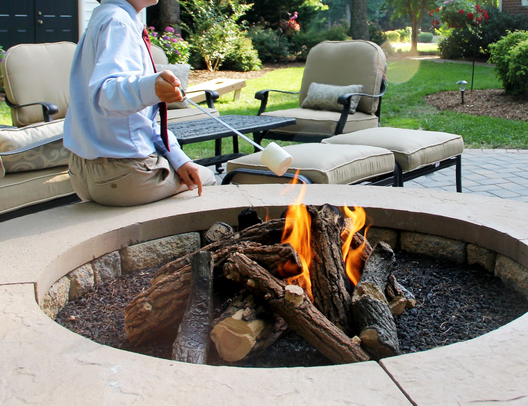 genz-teen-in-the-backyard-enjoying-the-fire-pit-2025-01-16-11-16-42-utc