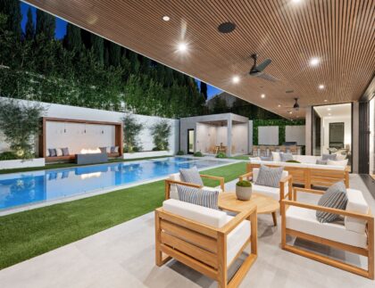 lush-green-patio-boasts-an-expansive-pool-and-invi-2024-01-22-20-47-51-utc