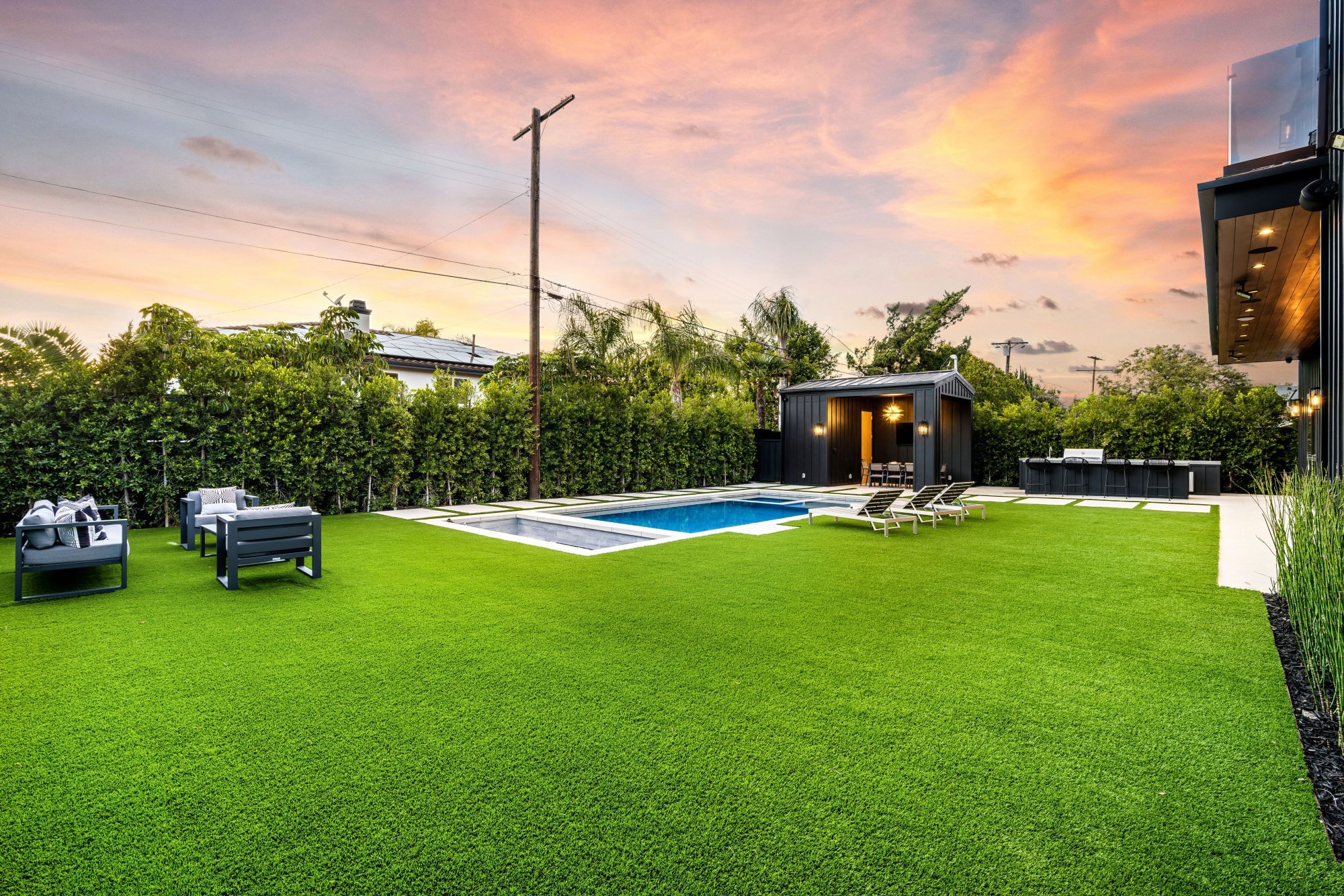 modern-backyard-with-pool-and-lounge-chairs-at-sun-2024-10-02-19-47-28-utc